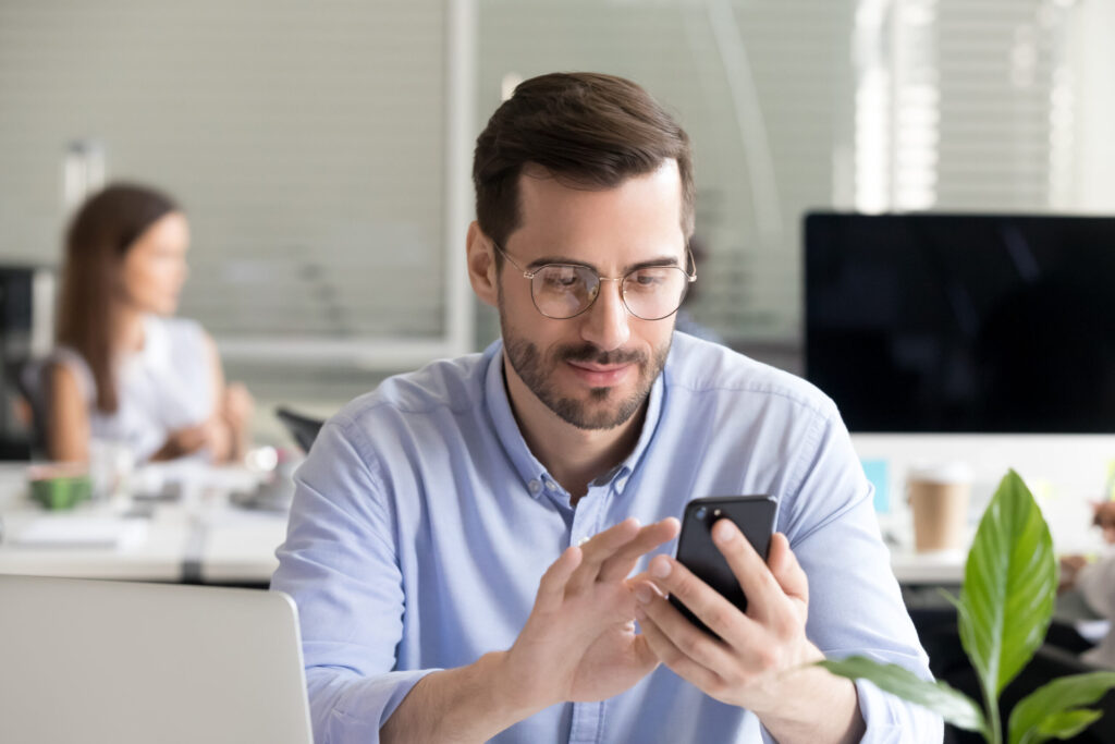 Adult with ADHD distracted by phone while trying to work