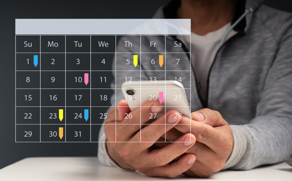 Man holding phone with overlaid calendar and sticky notes, illustrating ADHD adults’ struggle to use calendars effectively