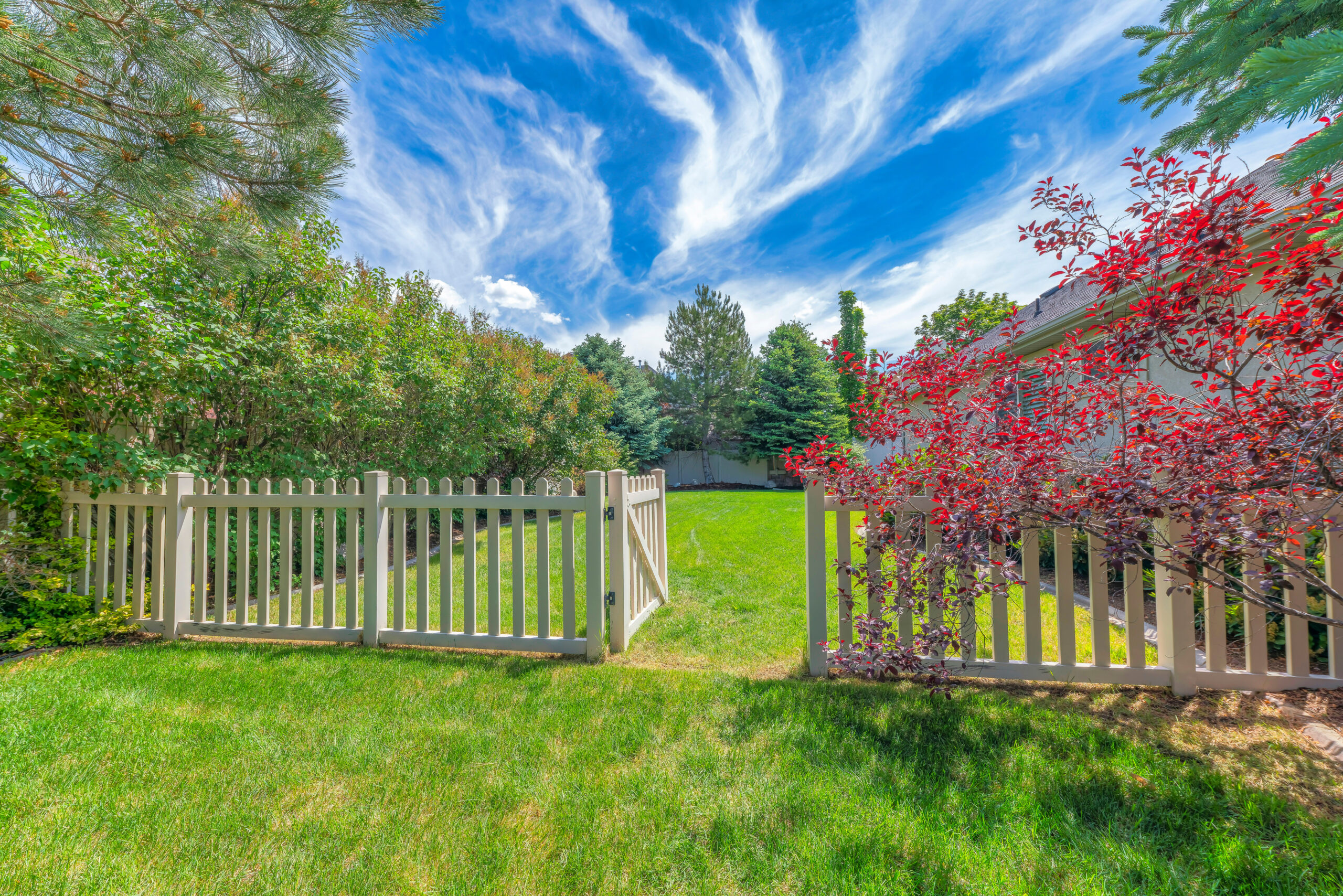 White picket fence with an open gate, symbolizing how adults with ADHD can recognize when a boundary is needed and use the right language to set it clearly.