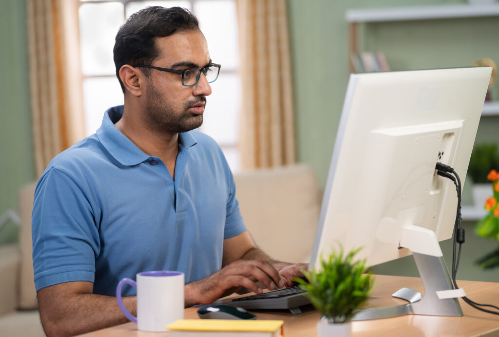 Man sitting at a desk before beginning a task, representing how to make getting started easier with ADHD.