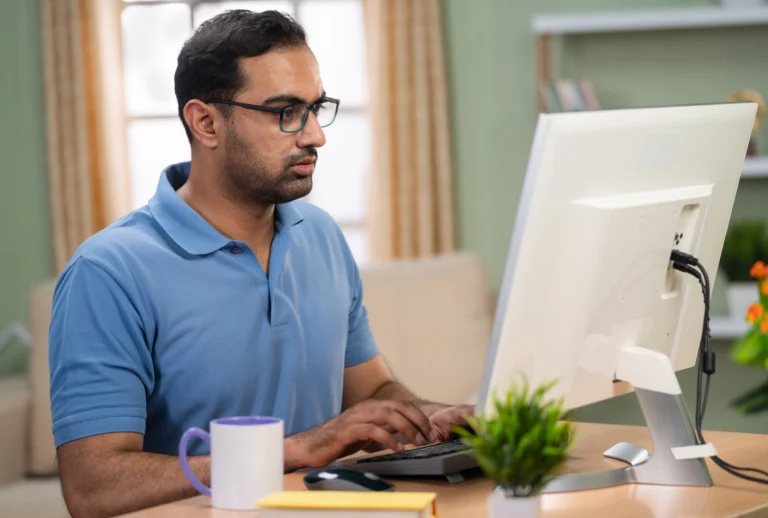 Man sitting at a desk before beginning a task, representing how to make getting started easier with ADHD.