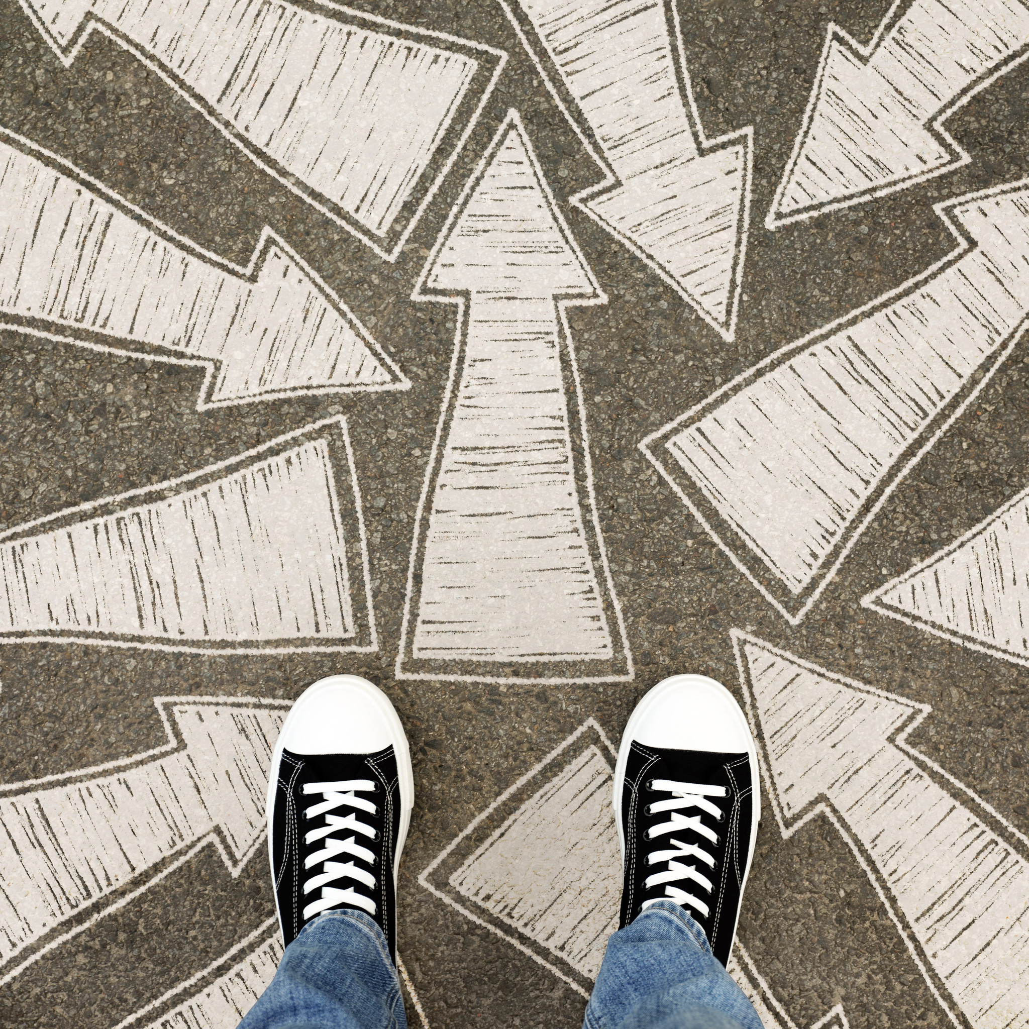 Person standing at multiple arrows on the ground, symbolizing ADHD overcommitting and difficulty deciding what to take on